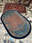 small oval antique wool rug